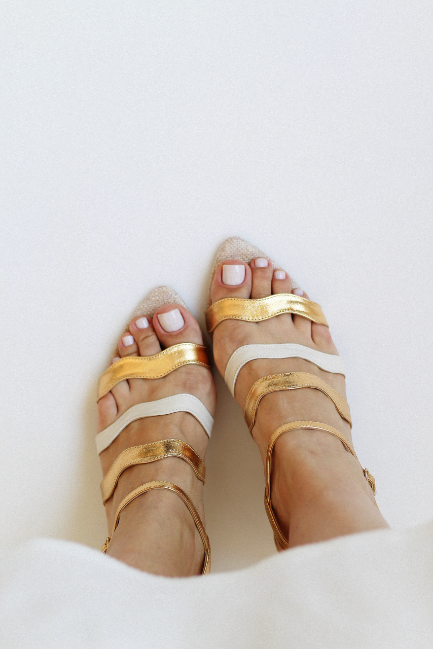Gaspea sandal in gold and off-white with acrylic sphere heel and chestnut wood.