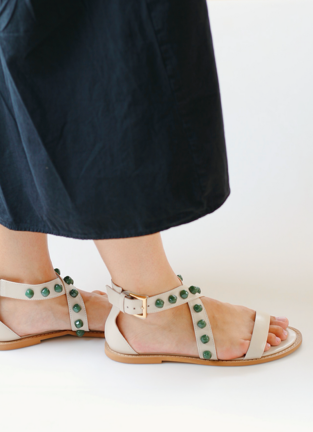Off-white emerald sandal with green stones.