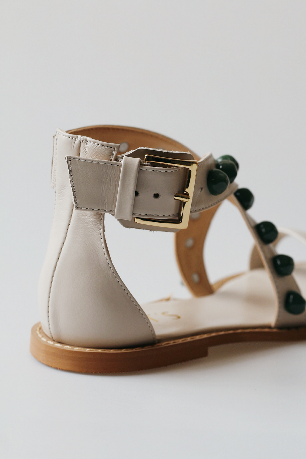 Off-white emerald sandal with green stones.
