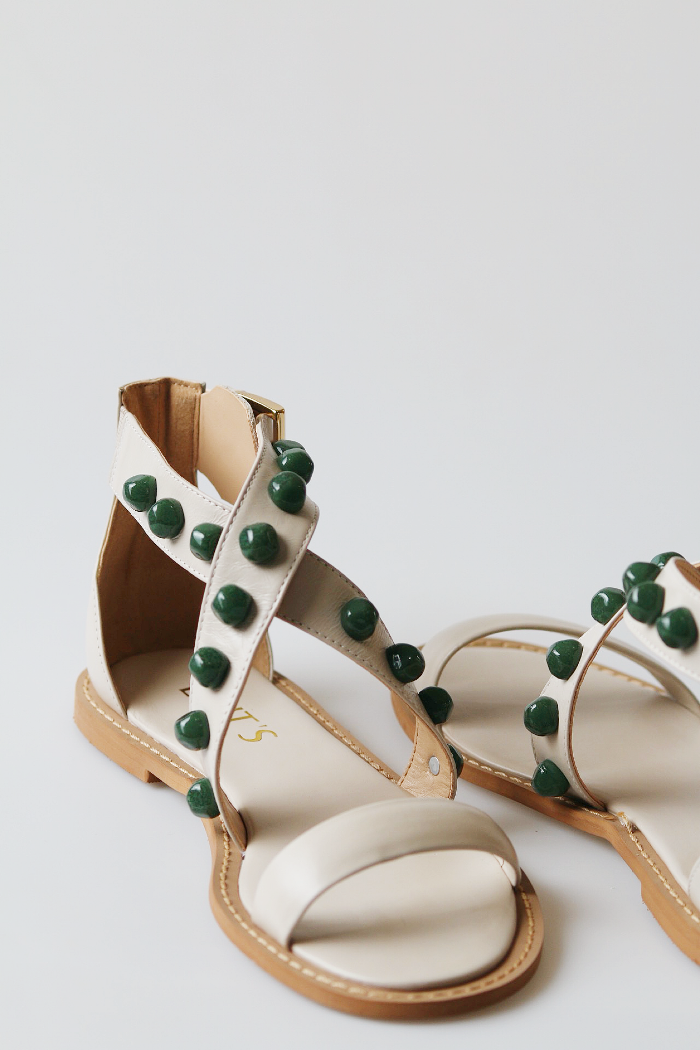 Off-white emerald sandal with green stones.