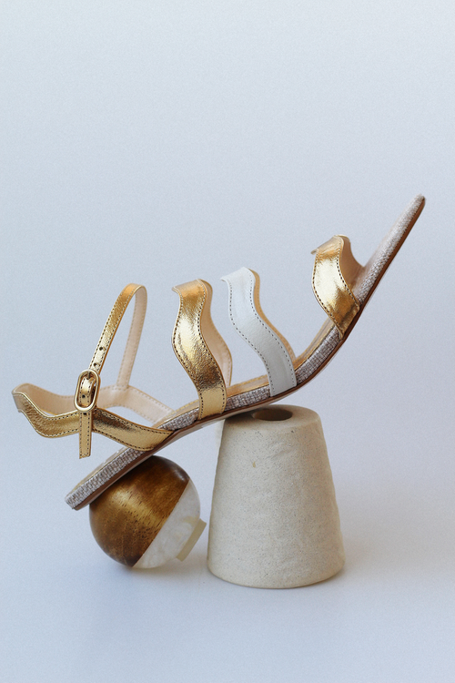 Gaspea sandal in gold and off-white with acrylic sphere heel and chestnut wood.