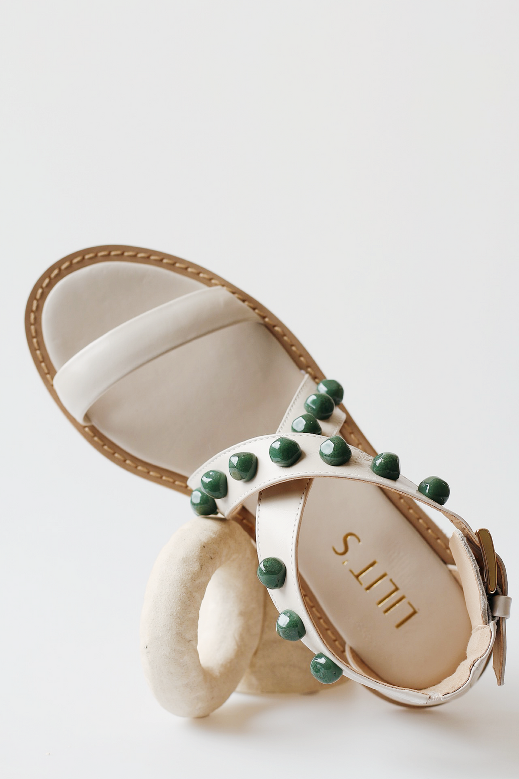Off-white emerald sandal with green stones.