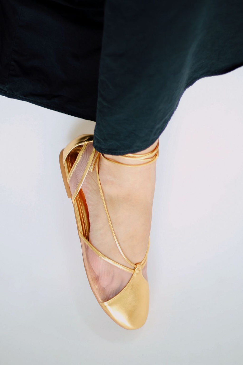 Gold ballerina Valerie with mesh details.