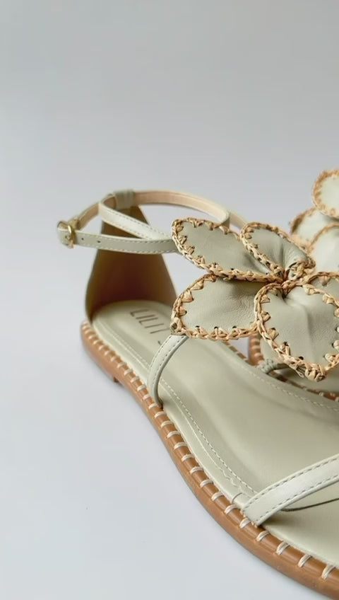 Eva sandal with embroidered raffia flower.